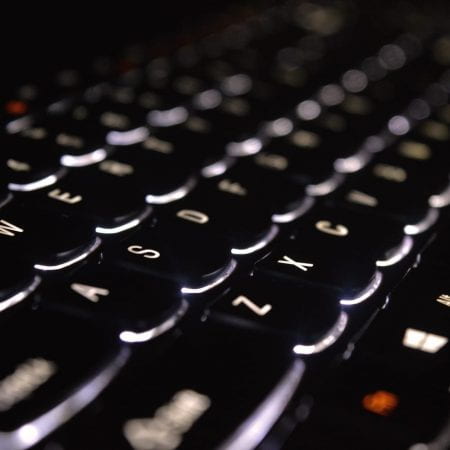 Close-up of glowing keyboard keys.