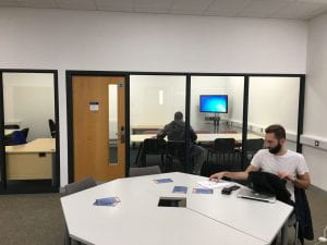 Two users working in the postgraduate study space.