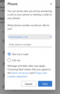 Screenshot showing Phone Change screen. There is space for a new phone number to be entered and the option of "Text me a code" is selected.